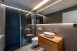 Step into modern luxury with this stunning bathroom design.