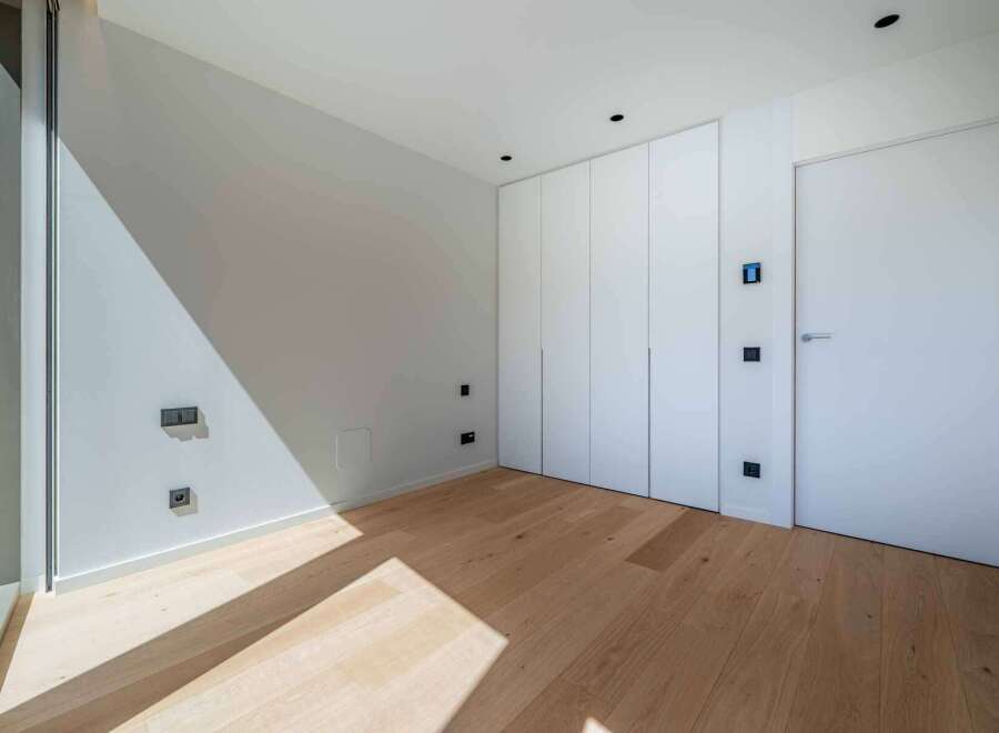 This modern room features a minimalist design with clean lines and a bright, airy feel.