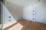 This modern room features a minimalist design with clean lines and a bright, airy feel.