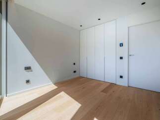 This modern room features a minimalist design with clean lines and a bright, airy feel.