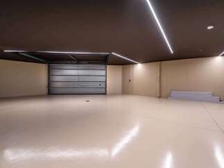 Discover the epitome of modern design in this stunning garage space.