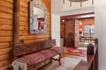 Step into rustic elegance with this stunning property, showcasing a warm and inviting interior.