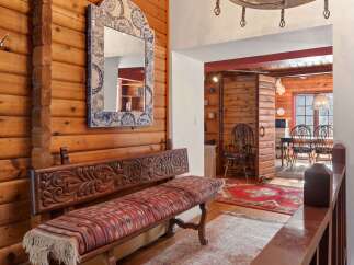 Step into rustic elegance with this stunning property, showcasing a warm and inviting interior.