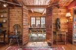 Step into rustic elegance with this stunning log cabin interior.