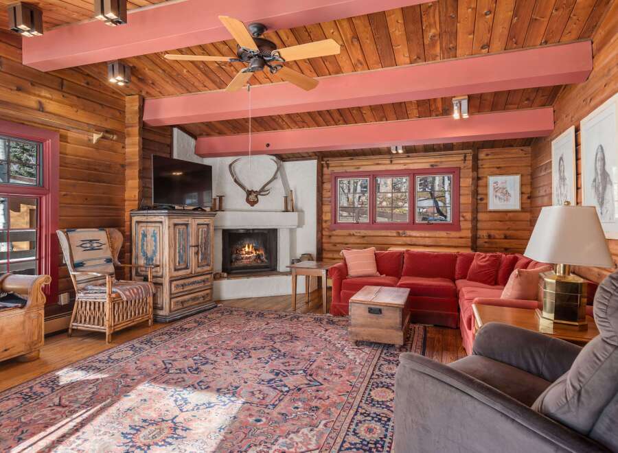Step into rustic elegance with this stunning cabin-style living room.