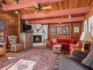 Step into rustic elegance with this stunning cabin-style living room.