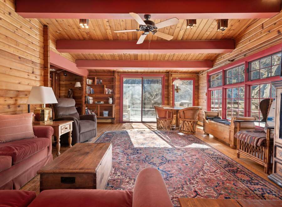 Step into rustic elegance with this stunning living space, showcasing a warm, inviting ambiance.