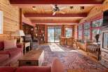 Step into rustic elegance with this stunning living space, showcasing a warm, inviting ambiance.