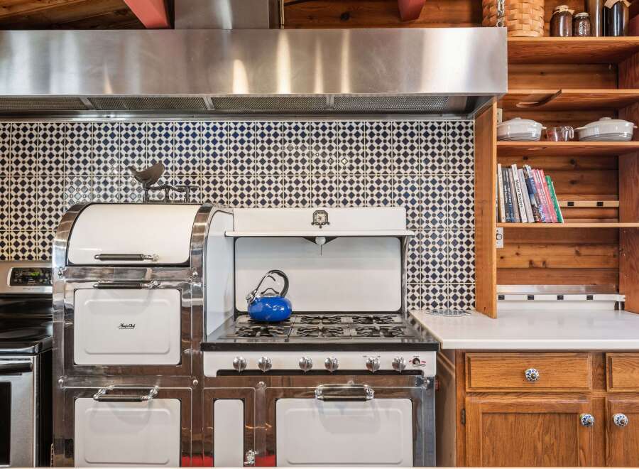 Step into a kitchen that blends vintage charm with modern convenience.
