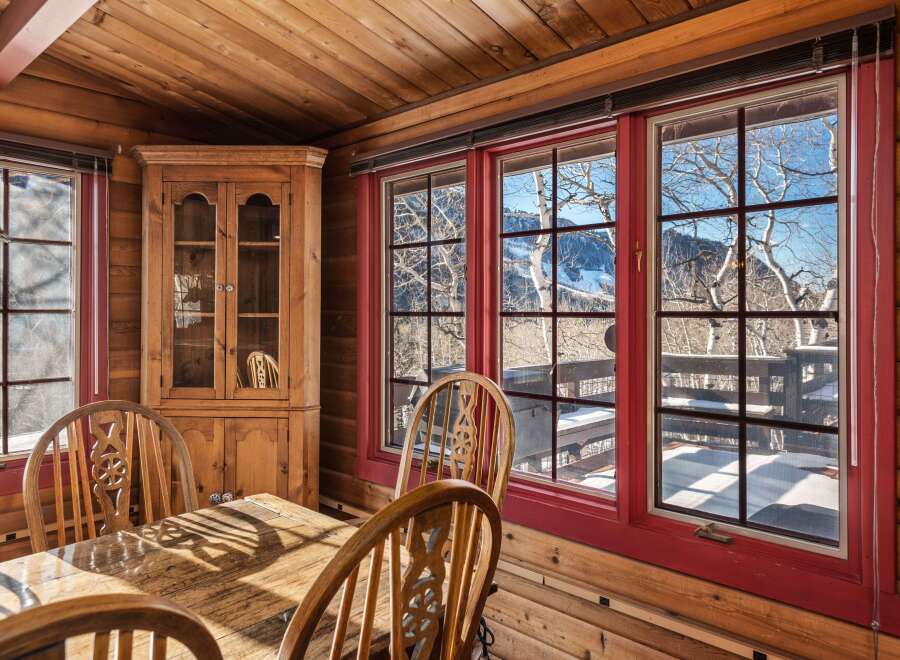 Step into a cozy dining area with stunning mountain views.