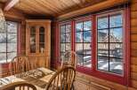 Step into a cozy dining area with stunning mountain views.
