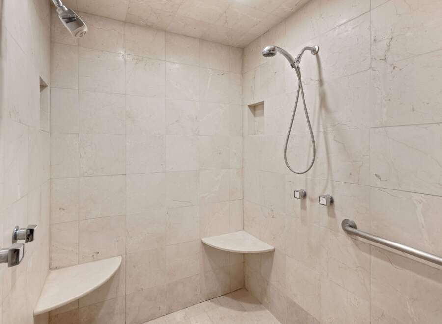 Step into a luxurious shower experience with this beautifully tiled bathroom.