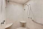 Step into a luxurious shower experience with this beautifully tiled bathroom.