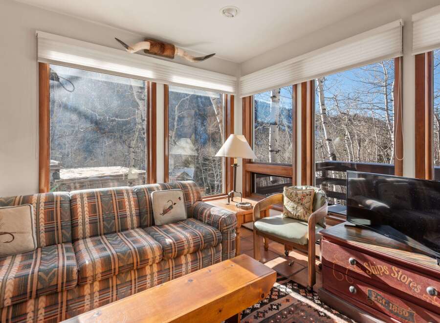 This stunning living room boasts breathtaking views and a cozy atmosphere.