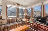 This stunning living room boasts breathtaking views and a cozy atmosphere.