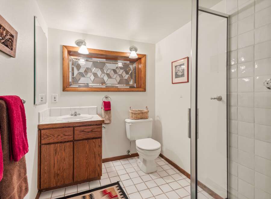 This inviting bathroom showcases a blend of functionality and style.