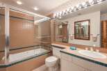 This bathroom features a classic design with a combination of functionality and style.