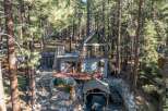 Nestled in a serene forest setting, this charming cabin offers a perfect blend of rustic charm and modern comfort.