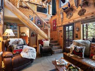 Step into rustic luxury with this stunning cabin-style home.