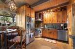Step into rustic elegance with this stunning kitchen! Featuring custom wood cabinetry, stainless steel appliances, and a unique stone backsplash, this space is perfect for both cooking and entertaining.