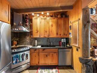 Step into the heart of this charming kitchen, where rustic elegance meets modern convenience.