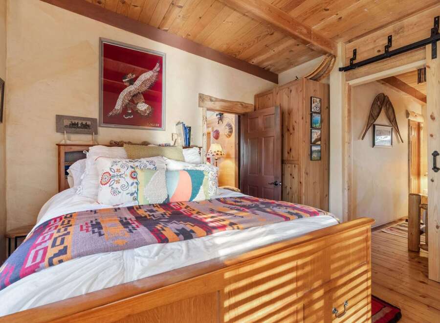 Step into a cozy bedroom retreat, where rustic charm meets modern comfort.