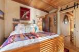 Step into a cozy bedroom retreat, where rustic charm meets modern comfort.