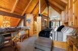 Step into rustic luxury with this stunning cabin bedroom.