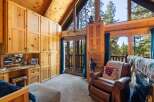 Step into a cozy retreat with this stunning property, featuring a beautifully crafted interior with natural wood finishes.