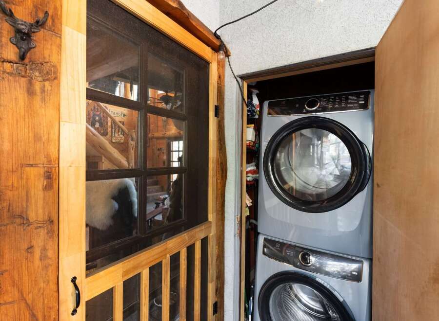 Step into rustic charm with this unique property! Featuring a cozy interior with a stacked washer and dryer, this home offers convenience and style.