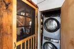 Step into rustic charm with this unique property! Featuring a cozy interior with a stacked washer and dryer, this home offers convenience and style.