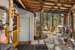 Escape to your own private oasis with this charming cabin nestled in the woods.