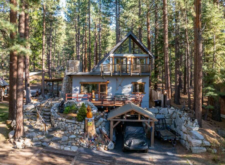 Nestled in a serene forest setting, this charming cabin offers a perfect blend of rustic charm and modern comfort.