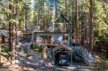 Nestled in a serene forest setting, this charming cabin offers a perfect blend of rustic charm and modern comfort.