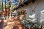 Escape to your mountain retreat! This charming property boasts a cozy outdoor seating area, perfect for enjoying the fresh air and stunning views.