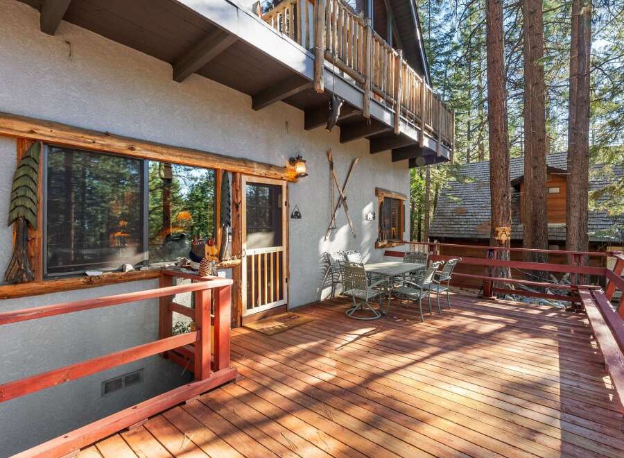 Enjoy the tranquility of this charming cabin with a spacious deck, perfect for outdoor gatherings.
