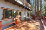 Enjoy the tranquility of this charming cabin with a spacious deck, perfect for outdoor gatherings.