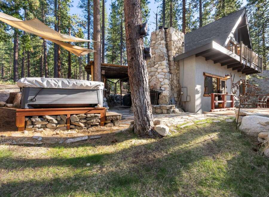 Escape to your dream retreat! This stunning property boasts a luxurious hot tub, perfect for unwinding amidst the serene beauty of nature.