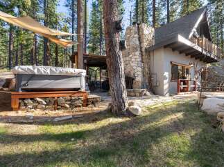 Escape to your dream retreat! This stunning property boasts a luxurious hot tub, perfect for unwinding amidst the serene beauty of nature.