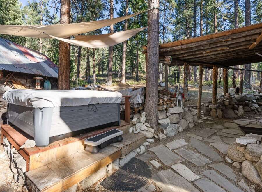 Escape to your own private oasis with this stunning property featuring a luxurious hot tub.