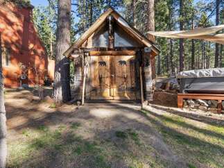 Discover a charming cabin retreat nestled in a serene wooded setting.