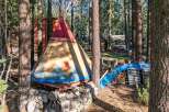 Escape to this unique property featuring a charming teepee nestled in a serene forest setting.