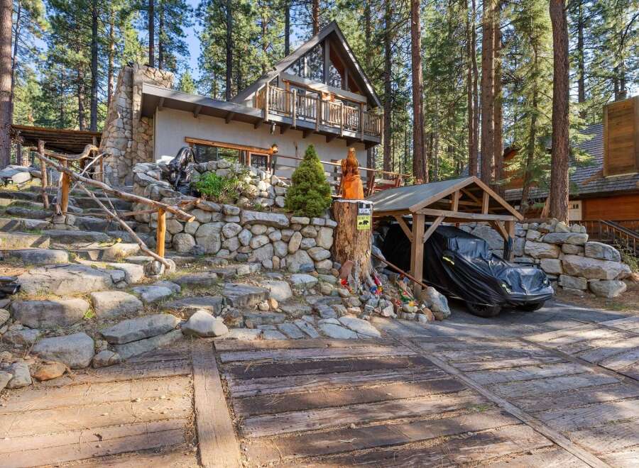 Nestled in a serene, wooded setting, this charming property offers a unique blend of rustic elegance and modern comfort.