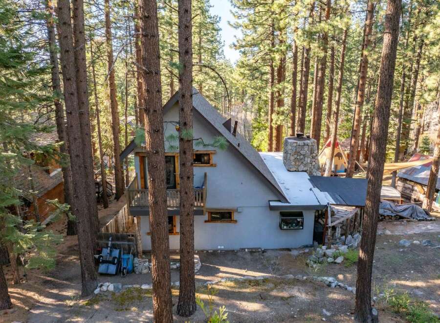 Nestled in a serene forest setting, this charming property offers a unique blend of rustic charm and modern comfort.