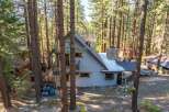 Nestled in a serene forest setting, this charming property offers a unique blend of rustic charm and modern comfort.