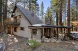 Nestled amidst towering pines, this charming cabin offers a serene escape.