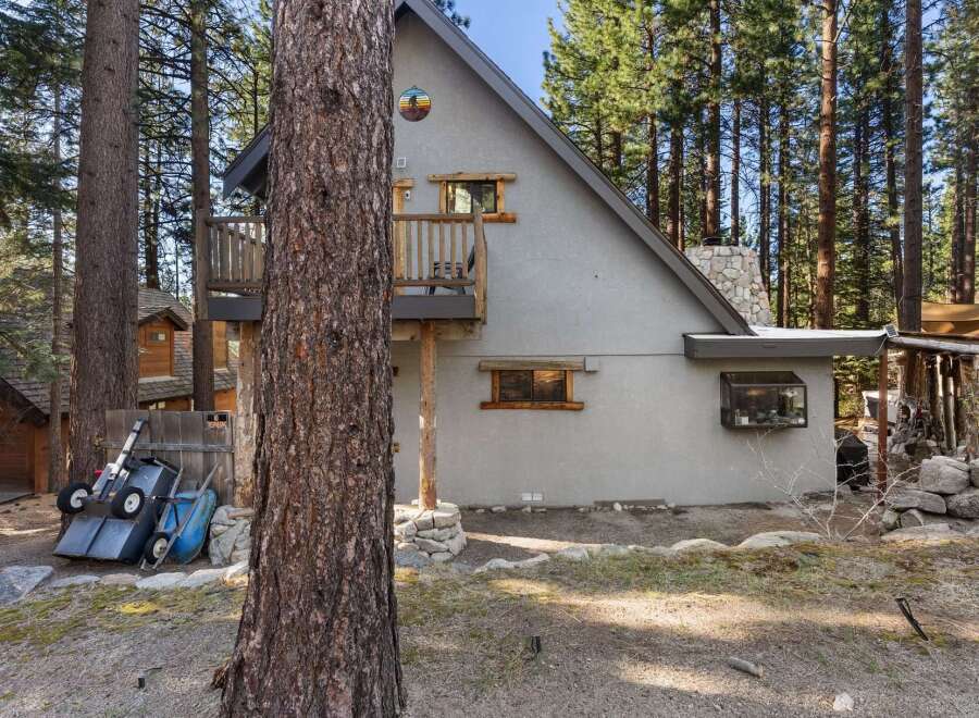 Nestled in a serene wooded setting, this charming property offers a unique blend of rustic charm and modern comfort.