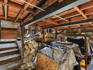 This property features a unique outdoor storage area, perfect for storing equipment or vehicles.