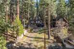 Nestled amidst towering trees, this stunning property offers a serene escape.