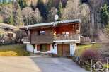 Discover this charming chalet nestled in a picturesque mountain setting.